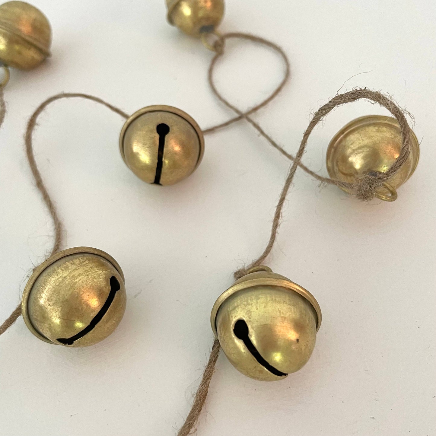 Rustic brass sleigh bell jute holiday garland handmade