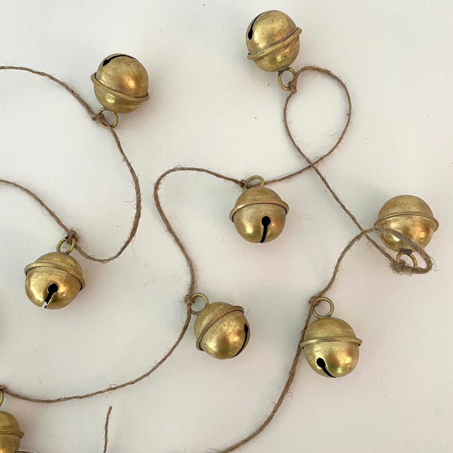 Rustic brass sleigh bell jute holiday garland handmade